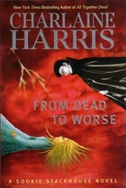 Sookie and a vampire against a stormy background.