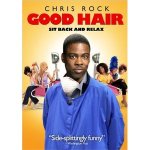 Chris Rock standing in front of a row of women at a hair salon.