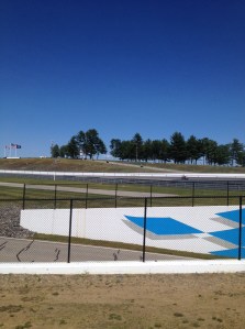 The motorcycle race track has many turns and elevation changes to be more interesting for the racers.