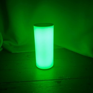 A glowing green lamp.