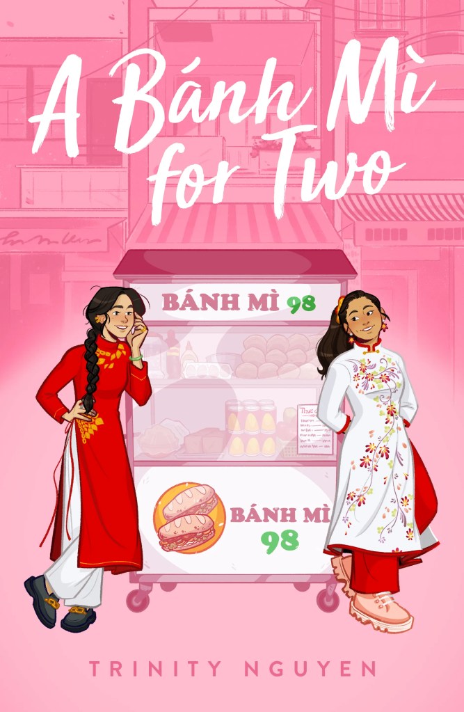 Image of a book cover. A bright pink cartoon style drawing of two young women standing next to a banh mi food cart. They are both wearing ao dai's. 