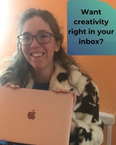 Image of a white woman holding a pink laptop and beaming at the camera. Text next to her reads "Want creativity right in your inbox?"